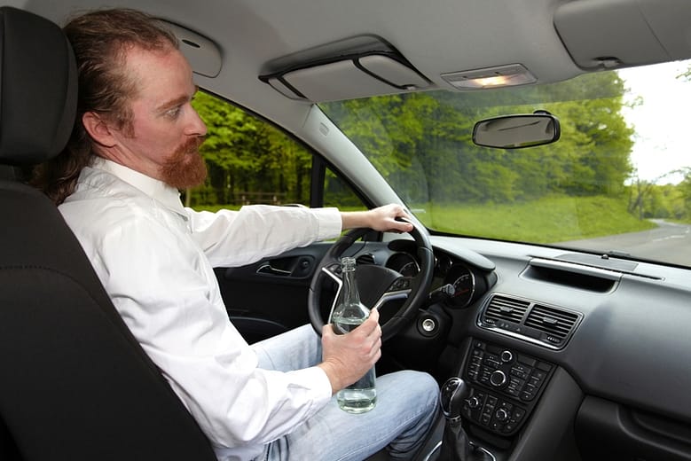 drunk-man-in-car-with-a-bottle-alcohol other med